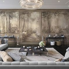 a living room filled with furniture and a chandelier hanging from the ceiling over a coffee table