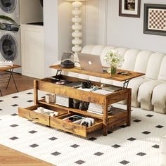 a living room filled with furniture and a laptop computer on top of a wooden table