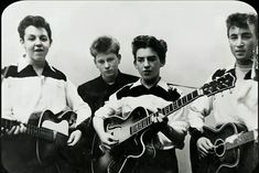 three young men are holding guitars and posing for the camera