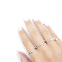 This simple stacking ring is sleek and clean with its smooth surface. The sleek appearance gives it an edgy feel. Wear this ring alone for subtle boldness or pair with other rings. These rings are carefully handcrafted. More Details:- Carefully Handmade- Surgical Stainless Steel - E-Coating (Anti-Tarnish)- Thickness: 3 mm- Metal Color: Silver Stackable Silver Rings, Silver Midi Rings, Ring Simple Silver, Silver Stackable Rings, Simple Stacking Rings, Silver Pinky Ring, Midi Rings Silver, Ring Stacks, Rings Stacking