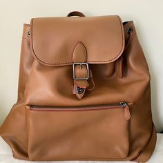 It's New And Not Used. Material Leather Color Light Brown Size H35w35d10(Cm) Designer Leather Backpack With Removable Pouch For Travel, Luxury Satchel Backpack For Errands, Designer Leather Backpack With Removable Pouch, Designer Everyday Backpack With Removable Pouch, Designer Leather Backpack For On-the-go, Luxury Leather Backpack For Errands, Luxury Soft Leather Backpack For Errands, Designer Leather Backpack With Detachable Strap For On-the-go, Designer Backpack With Leather Lining