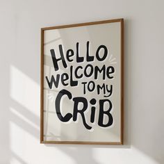 there is a framed sign that says hello welcome to my crib on the wall