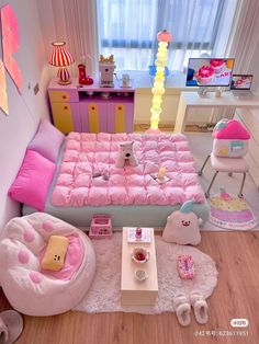 a bedroom with pink furniture and accessories on the floor