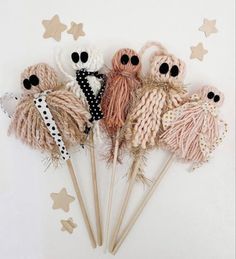 there are knitting needles and yarns in the shape of skulls on top of each other