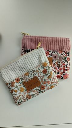 three small purses sitting on top of a table