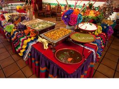 a buffet table with many different foods on it