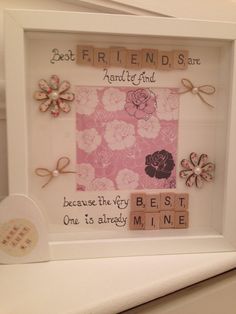 a white frame with flowers and words on it