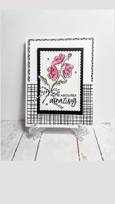 a card with pink flowers on it and the words happy anniversary written in black ink