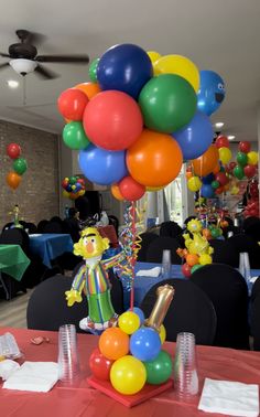 a bunch of balloons that are on top of a table