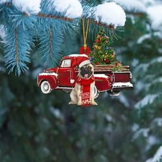 a red truck ornament with a pug dog in it hanging from a christmas tree