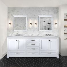 a white bathroom with two sinks and mirrors on the wall next to a tiled floor