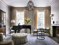 a living room filled with furniture and a piano