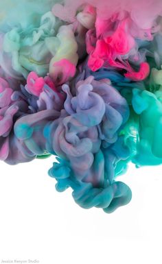 colorful ink is mixed together in water