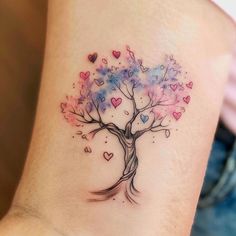 a tree with hearts on its trunk is shown in the shape of a heart tattoo