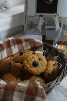 a basket filled with muffins on top of a table