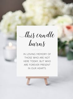 a sign that reads reserved for father of the groom on top of a table with flowers