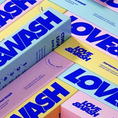 several books stacked on top of each other with the words love wash printed on them