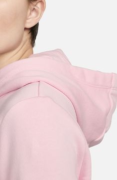 The brand's best-selling Club Fleece adds a cozy, familiar feel and a consistent fit to an essential hoodie brushed for warmth and superior softness. Drawstring hood 80% cotton, 20% polyester Machine wash, dry flat Imported Nike Sportswear Club Fleece, Essential Hoodie, Nike Sportswear, Fleece Hoodie, Soft Pink, Pink White, Nordstrom, Nike, Pink