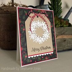 a christmas card with snowflakes on it and a tag that says merry christmas