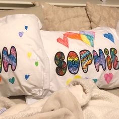 two pillows that have been made to look like they are decorated with the word love