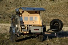 an off - road vehicle with a trailer attached to it