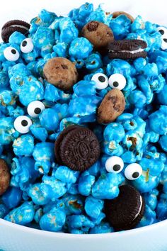 a bowl filled with blue cereal covered in googly eyes and oreo - eyeballs