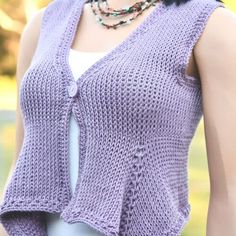 a woman wearing a purple knitted vest