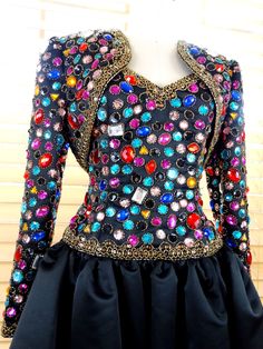 "This is a an absolutely gorgeous vintage dress and bolero jacket by Oleg Cassini, Black Tie. Both are beautifully detailed with multicolored jewels, beads and sequins. They'rein perfect condition! Bust - 36\" Waist - 30\" Hips - free Dress Length - 37\" Tag Size - 10 (please refer to measurements) This dress comes from a pet-free and smoke-free home. If you would like more info or have any questions, please don't hesitate to ask!" Vintage Multicolor Dress For Costume Party, Vintage Multicolor Dresses For Costume Party, Glamorous Fitted Costume Dress, Vintage Fitted Dress For Ballroom, Fitted Beaded Dress For Costume Party, Fitted Sequin Costume Dress, Vintage Multicolor Formal Dress, Fitted Vintage Ballroom Dresses, Vintage Multicolor Costume Party Dress