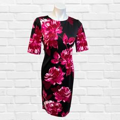 This Cerise and Black Floral Dress is tailored to perfection, creating a shift dress that is both elegant and classy. Unique fashion, designed with a women's fashion boutique in mind, makes this dress stand out from the pack. Classic Tailored Elegant Shift Dress, featuring around neck , 3/4 sleeve and back zip. You can not go wrong with this one. Fabric 95% Polyester / 5% Spandex Dry Clean Smart Casual Wear, Black Floral Dress, Dress Stand, The Pack, Unique Outfits, Floral Dress Black, Smart Casual, Unique Fashion, Boutique Clothing