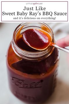 a person is holding a spoon full of jam