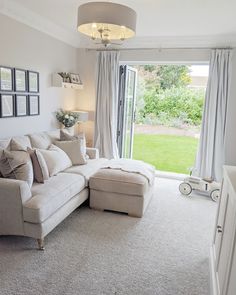 a living room filled with furniture and a sliding glass door