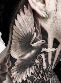 a man with a bird tattoo on his neck and behind his ear is the word love