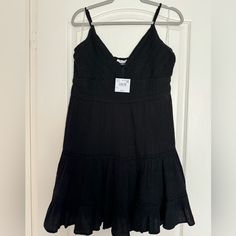 Cute, Flowy Back Beach Dress. Never Worn, With Tags. Black Summer Sundress For The Beach, Chic Black Sundress For Beach Season, Black Summer Sundress For Beach Season, Summer Black Sundress For Beach, Black Sundress For The Beach, Black Sundress For Beach Season, Black Sundress For Beach Season Vacation, Black Sundress For Beach Vacation, Black Mini Dress For Beach Vacation