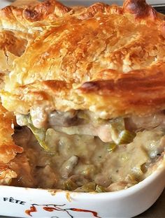 a casserole dish with meat and vegetables in it is ready to be eaten