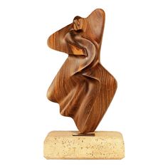 a wooden sculpture is shown on a white background