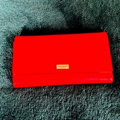 Beautiful Brand New Kate Spade Wallet In Red. Lots Of Pockets And Super Convenient Storage Slots. Chic Red Leather Wallets, Chic Red Wallet With Card Slots, Red Evening Wallet With Card Slots, Red Leather Evening Wallet, Red Bifold Evening Bag, Red Evening Wallet, Chic Red Evening Wallet, Red Clutch Wallet For Formal Occasions, Red Formal Clutch With Card Slots