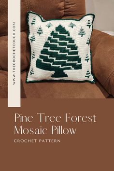 A green and white crochet pillow featuring a mosaic design of a pine tree in the center, surrounded by smaller trees. The pillow’s back has a striped mosaic pattern, adding a complementary touch to the front design.