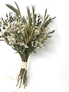 a bunch of white flowers tied to a string