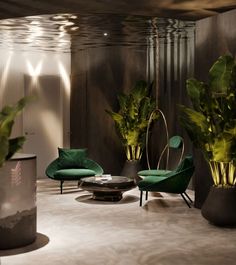 some green chairs and plants in a room