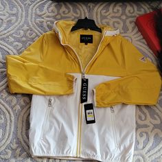 Bmwt! Guess Jacket In Yellow/ White Everyday Casual Outerwear Jacket. Features Hand Entry Pocket, Long Sleeve, Front Zip-Up Style With Your Favorite Pair Of Jeans, Denim Workout Pants, And Joggers. For Any Season Wear. Fast Ship White Weatherproof Fall Outerwear, White Waterproof Outerwear For Streetwear, White Waterproof Windbreaker For Fall, Casual White Weatherproof Outerwear, White Waterproof Outerwear For Casual Wear, White Weatherproof Windbreaker For Fall, Weatherproof White Windbreaker For Fall, Casual White Weatherproof Windbreaker, White Weatherproof Outerwear For Spring