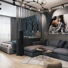 a living room filled with furniture next to a large painting on the wall above a gray couch