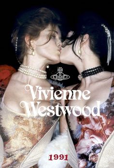 two women kissing each other with the words viviene westwood in front of them