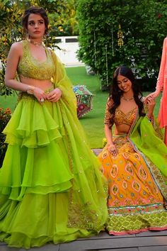 Parrot green can-can attached layered lehenga with an embroidered waist. Paired with a tassel detailed, zari and sequin embroidered padded blouse and a scallop hem embroidered dupatta. - Aza Fashions Green Lehenga For Diwali, Green Choli For Diwali, Green Tilla Sharara For Festivals, Green Lehenga With Tilla For Reception, Green Choli With Cutdana Detailing, Green Choli With Cutdana, Green Lehenga With Tilla For Festivals, Pista Green Lehenga For Festivals, Green Sequin Lehenga