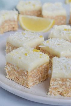 several pieces of cake on a plate with lemons