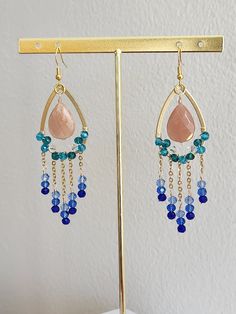 Elegant Blue Drop Danglers, Handmade Elegant Pink Danglers, Handmade Dangle Chandelier Earrings For Party, Elegant Blue Drop Earrings, Blue Elegant Handmade Danglers, Handmade Blue Elegant Danglers, Elegant Blue Danglers For Party, Long Drop Chandelier Earrings With Dangling Beads For Gift, Gift Long Drop Chandelier Earrings