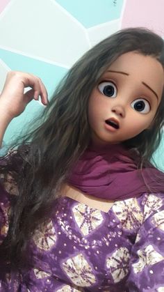 a close up of a doll with long hair and big eyes wearing a purple dress