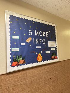 a bulletin board with words and pictures on it in an office building's hallway