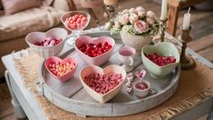 valentine's day treats arranged on a tray in the shape of heart shaped bowls