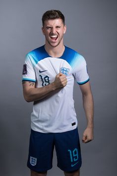 a soccer player is posing for the camera