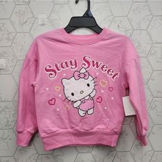 This Adorable Sweatshirt Features The Popular Character Hello Kitty On A Comfortable Cotton Blend Material. The Long Sleeves And Pullover Style Make It Perfect For Cooler Weather. It Comes In A Pretty Pink Color And Is Available In Size Xs, Fitting Girls Who Wear Size 4/5. The Sweatshirt Is From The Brand Comfy And Is Ideal For Any Hello Kitty Fan Who Wants To Add A Cute And Cozy Piece To Their Wardrobe. Kuromi Clothes, Hello Kitty Shirts, Sanrio Clothes, Sweatsuit Outfit, Hello Kitty Hoodie, Toddler Girl Halloween, Hello Kitty Sweatshirt, Hello Kitty Baby, Kitty Clothes